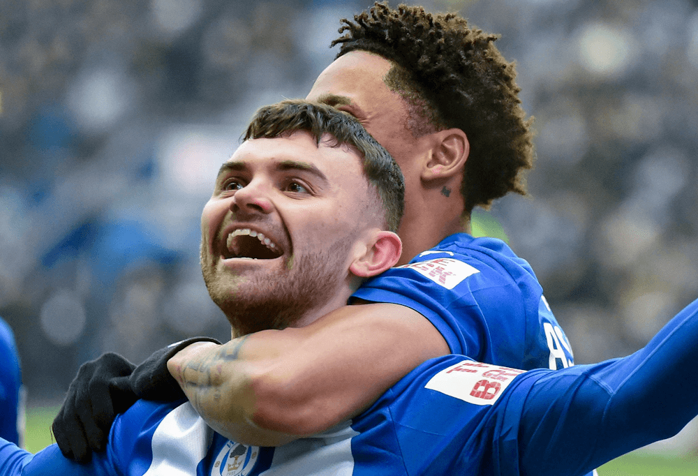 Wigan. Source: Official Facebook. Edited photo.