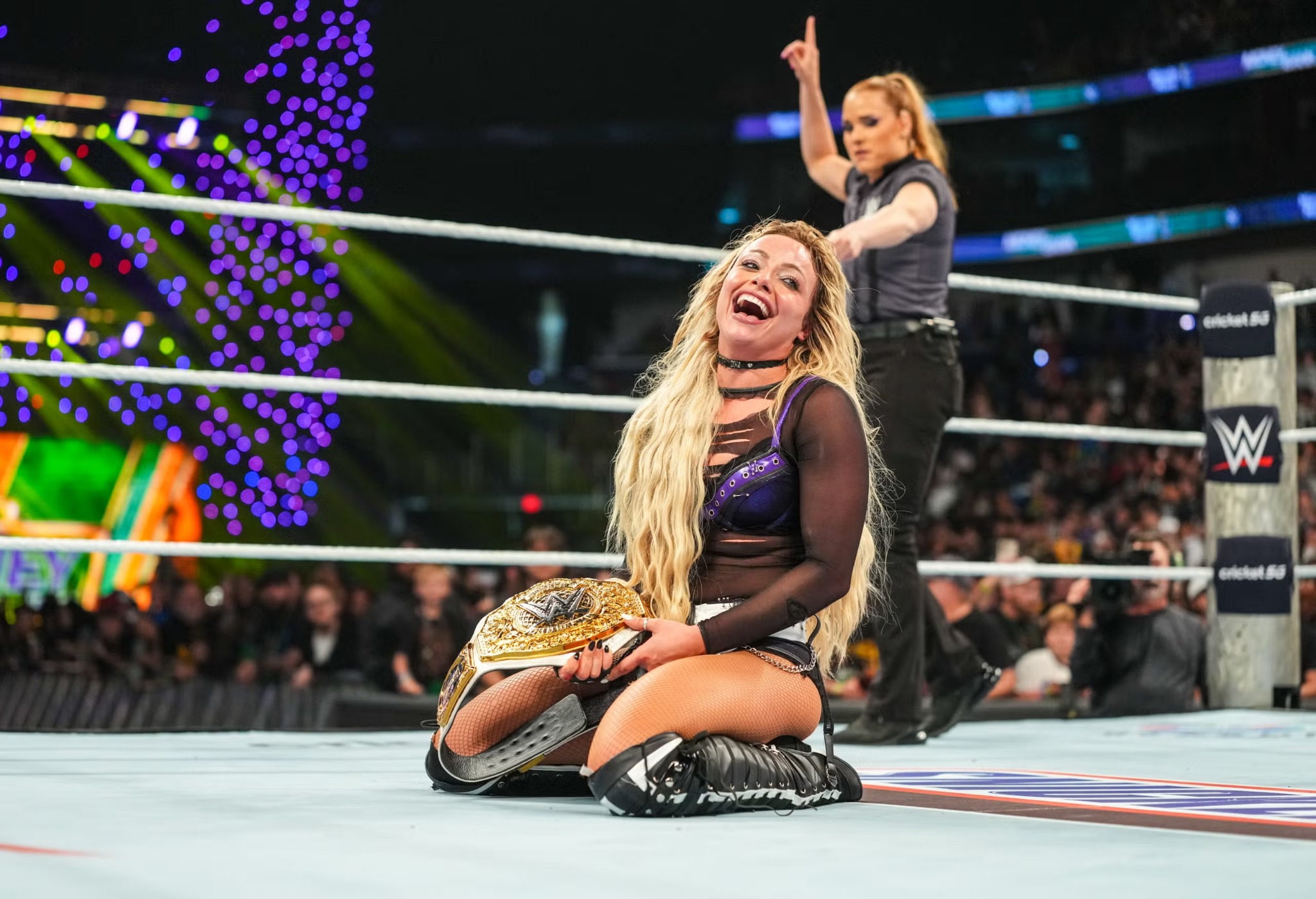 Liv Morgan celebrates winning the Women's World Championship at WWE Money in the Bank 2026